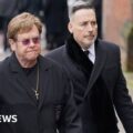 Elton John and Tony Blair at Derek Draper's funeral